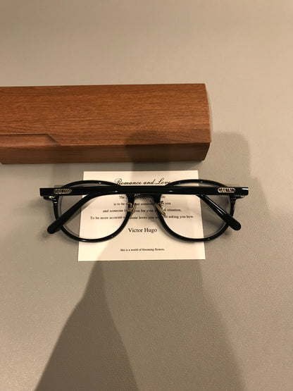 Oval Eyeglass Frames with a Thick Upper Rim, Black, Burgundy or Tortoi temple detail